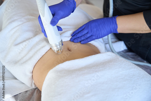 Cuadro en lienzo Close up of cosmetologist in protective gloves making lifting procedure of woman