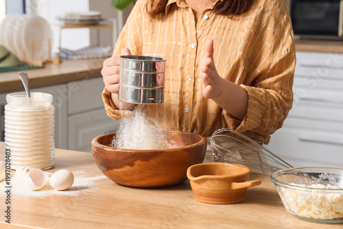 Woman with flour preparing ...
