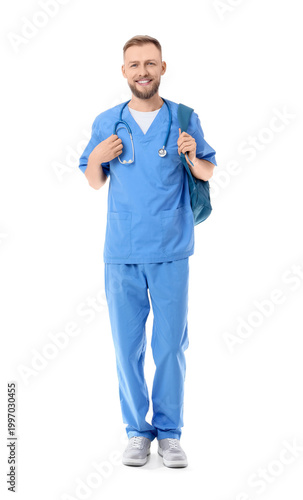 Handsome medical intern with backpack on white background