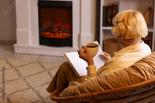 Senior woman with tea cup r...