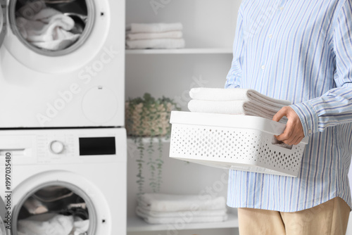 Woman with basket of towels...