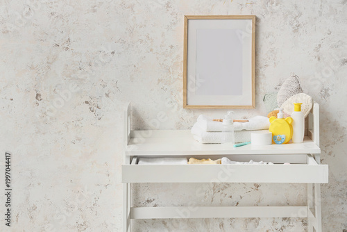 Changing table with baby ac...