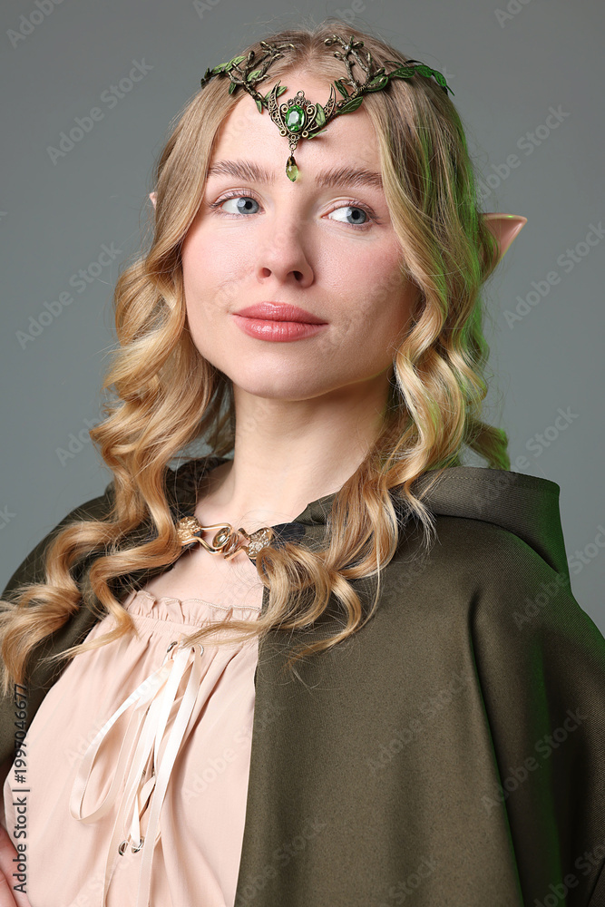 Obraz premium Portrait of beautiful elf girl on grey background