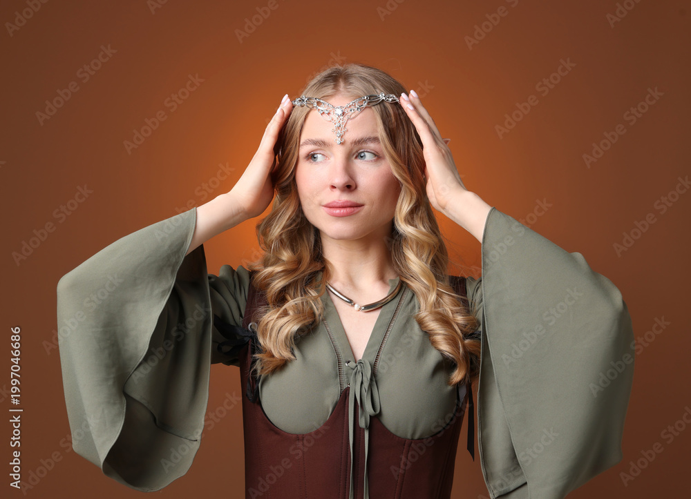 Fototapeta premium Beautiful elf girl on brown gradient background