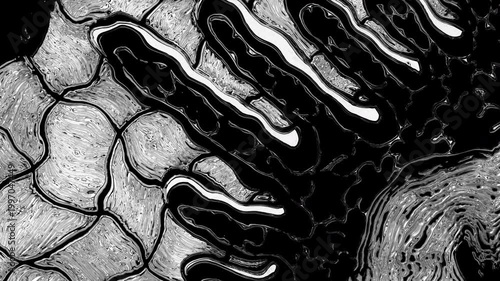 Abstract black liquid spreading over textured surface
