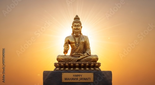 Golden statue of lord mahavir sitting in meditation against a radiant sunset background
