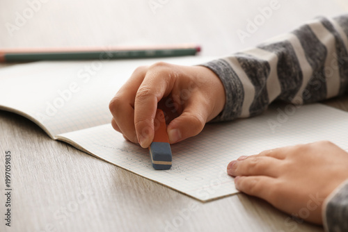 Child erasing something in ...