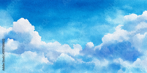 Beautiful fluffy white cumulus clouds drift across a bright blue summer sky in this peaceful nature cloudscape on a clear day