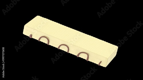 Spinning white chocolate wafer on black background