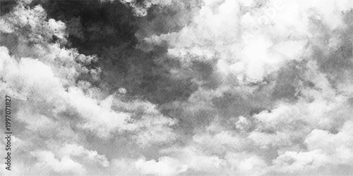 A dramatic black and white cloudscape captures the moody atmosphere of a storm brewing in the dark summer sky with fluffy white clouds drifting through the overcast nature