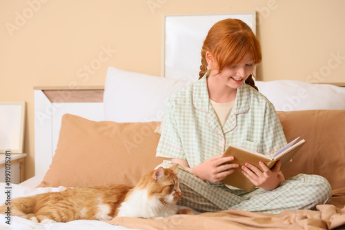 Teenage redhead girl in paj...