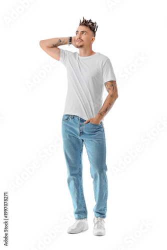 Tattooed young man with dreadlocks on white background