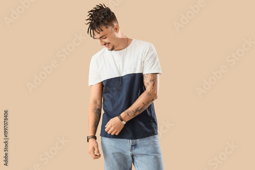 Young man with dreadlocks o...