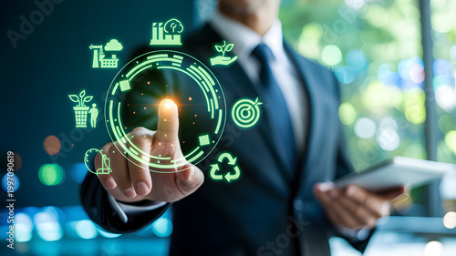 Businessman touching glowing digital circle with environmental icons during sustainable business meeting