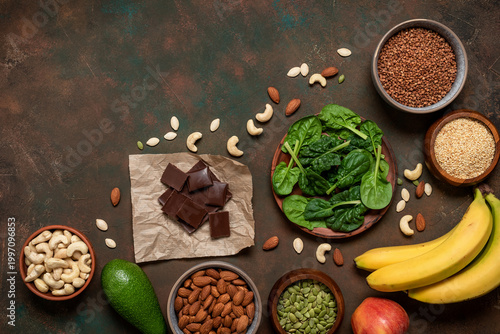 Magnesium rich food on dark grunge background, top view, flat lay, copy space. Various foods containing Mg