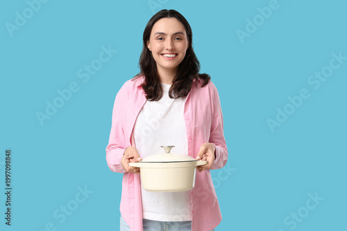 Young woman holding cooking...