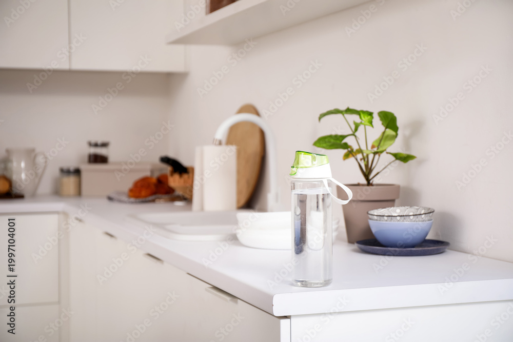 Fototapeta premium Sports water bottle on counter in kitchen