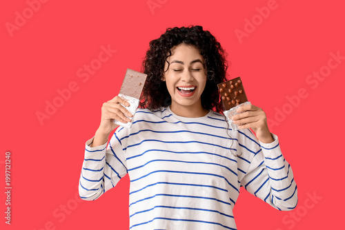 Happy young woman holding t...