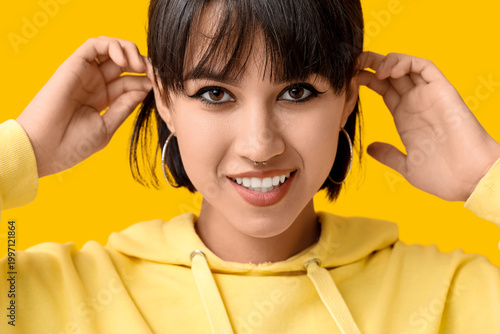 Happy stylish young woman w...