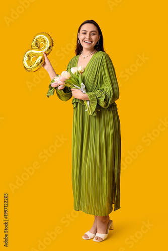 Happy young woman with gold...