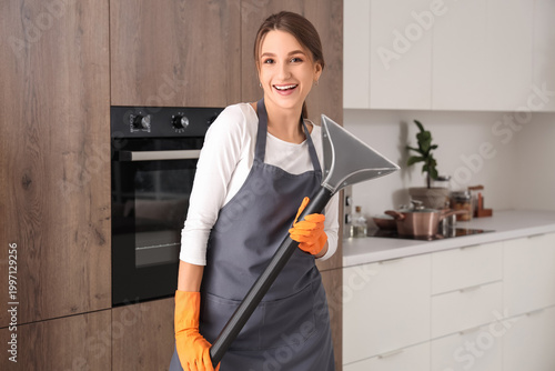 Female janitor with vacuum ...