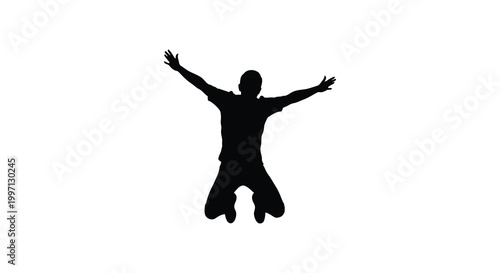A joyful person leaps with arms outstretched in a dark silhouette