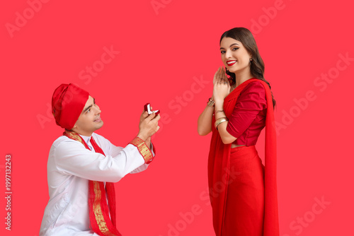 Young Indian man with engag...