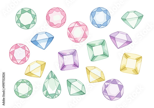 Collection of colorful faceted gemstones scattered on a white background