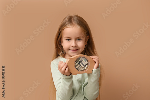 Cute little girl with piggy...