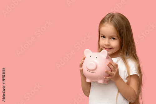 Cute little girl with piggy...