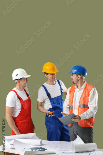 Team of male builders with ...