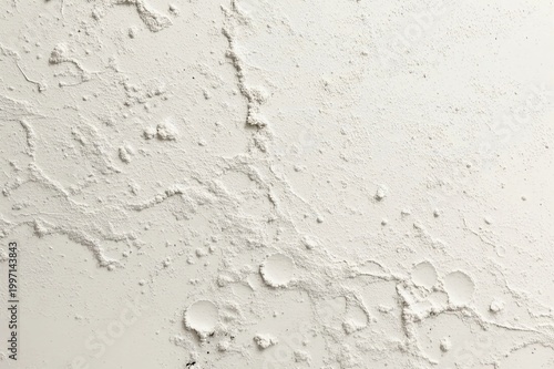 White rough plaster wall texture with cracks, bumps and uneven surface, abstract background for design and construction concept.