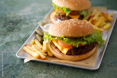 Homemade cheeseburgers with fries