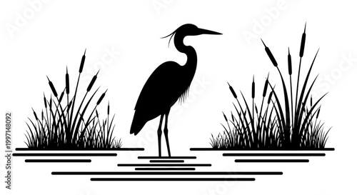 Black silhouette of a heron standing in water with cattails