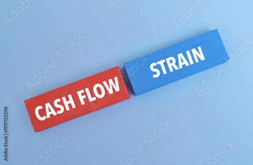 Quadro su tela Coloured blocks with text CASH FLOW STRAIN, Symbolizing financial pressure, li