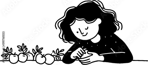 Young person peeling fruit while seated at wooden table interior