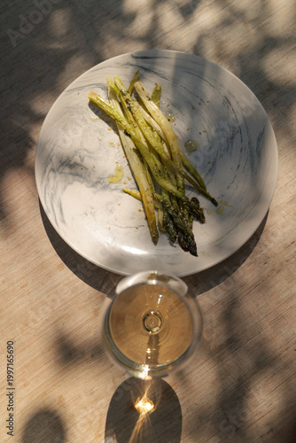 Vászonkép Asparagus with butter and white chardonnay wine, outdoor summer eating, fresh organic vegetables from garden farm, asparagus a la flamande