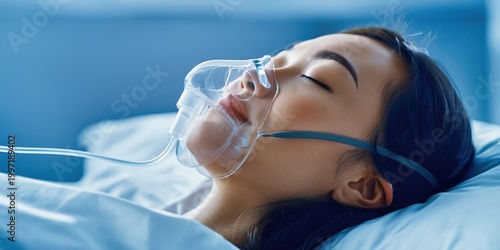 Patient with closed eyes receiving oxygen therapy through a mask in a hospital bed