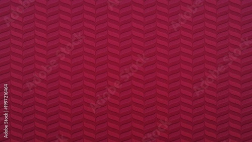 Deep crimson red geometric chevron pattern fabric texture background with subtle shadow effect