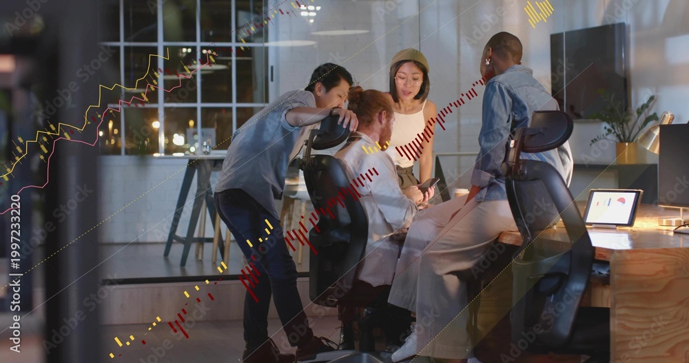 Fototapeta premium Meeting team in business casual reviewing market charts at night in office with laptop, smartphone