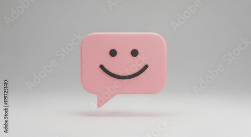 Pink speech bubble with smiling face on gray background symbolizing happiness and friendly communication