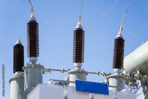 Φωτογραφία Industrial high voltage power transformers with ceramic bushings at an electrica