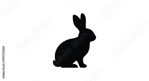 A simple black silhouette of a rabbit sitting in a resting pose silhouette