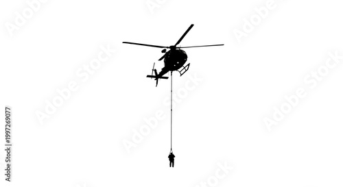 Rescue helicopter with person on rope.