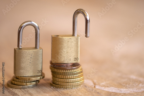 Brass Padlocks on Euro Coins Stack for Financial Security Concept