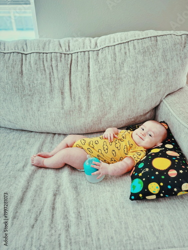 Bild auf Leinwand silly baby with bottle