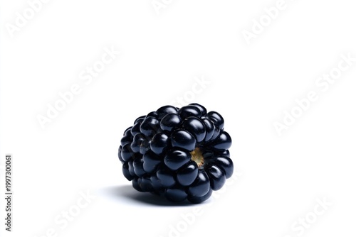 Fresh Blackberry on a White Surface With Another Berry in the Background