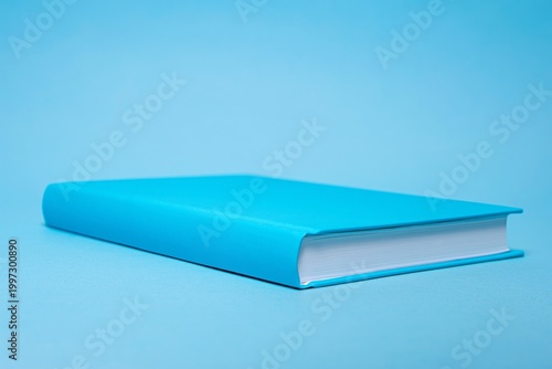 Bright Blue Book on a Light Blue Surface in a Simple Setting