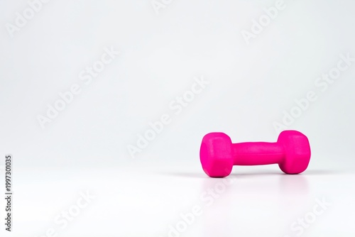 Bright Pink Dumbbell on a White Background for Fitness and Exercise Routines