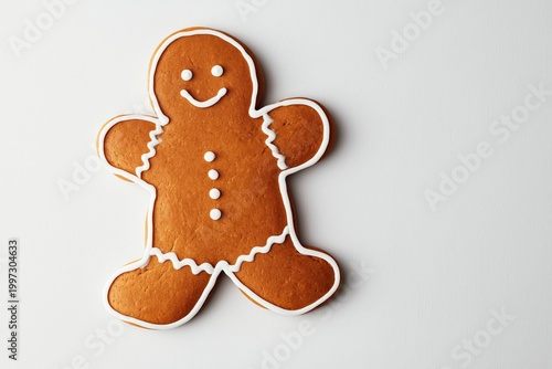 Gingerbread Man Cookie Sits on a White Surface Ready for Holiday Decoration a...
